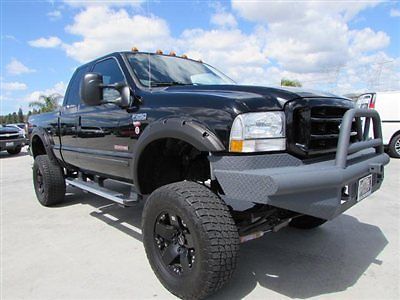 04 ford f250 extra cab diesel 4x4 lifted black only 80k miles
