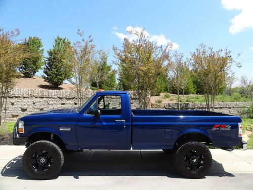 Ford f250 fx4  5-speed 8' bed custom 18" wheels &amp; paint, lifted, new tires