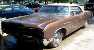 1968, convertible, bronze color, all original parts, stored in garage, some rust