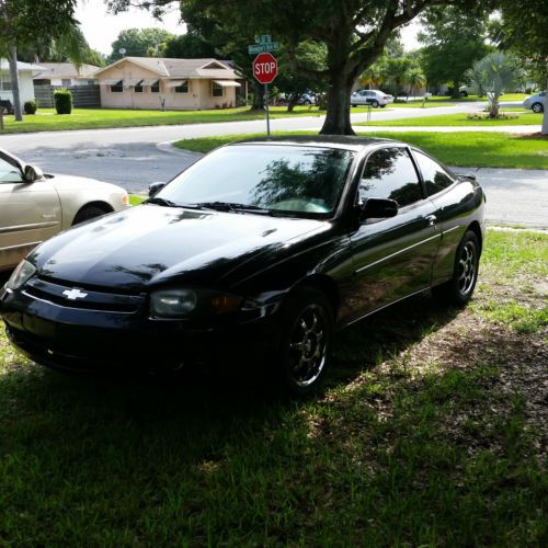 Black 2 door coupe in good condition- some dents
