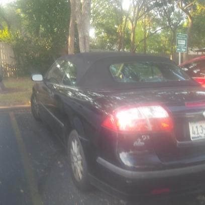 Convertible, auto, black with gray leather, body and seats in good condition