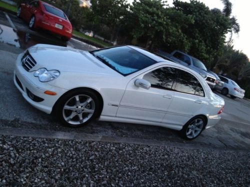 Almost flawless mercedes benz in white with rare black leather interior