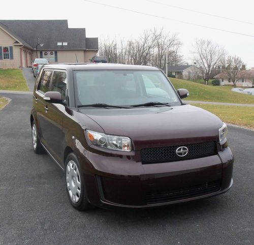 2010 burgandy w/black int. 67k  5 sp manual excllent running cond. few ext dings