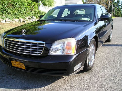 Nice black deville !! chrome wheels tinted windows, nice look !!