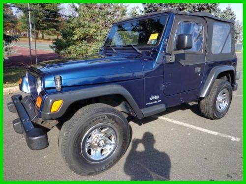 03 jeep wrangler se 5 speed trans 4 cyl nice tires top in great shape no reserve