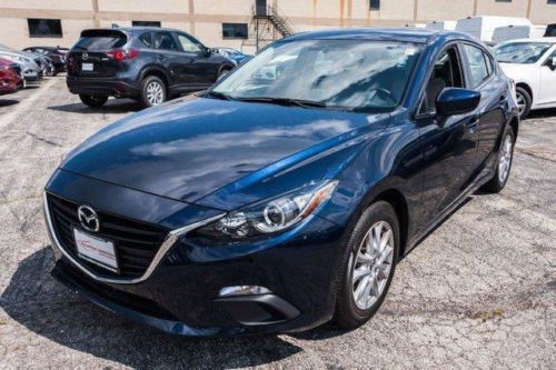 Like new 2014 mazda 3i touring w/entertainment package. less than 1000 miles!