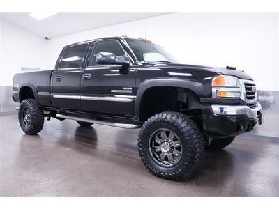 Lifted duramax diesel with toyo m/t tires - sunroof and running bars- black 4x4