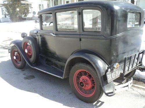 Black 1930 ford model a fordor, good, driveable original condition.