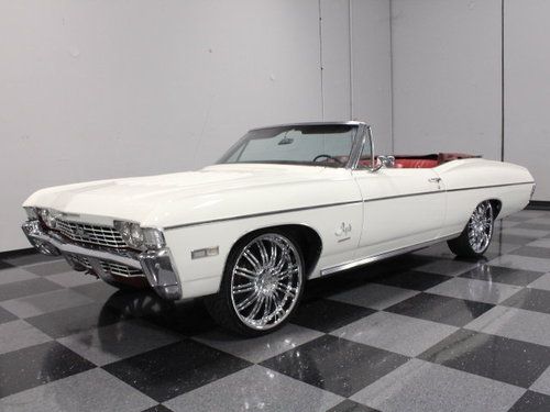 396 ci, restored in correct ermie white on red, power top, a/c, ps, pb, 22" rims