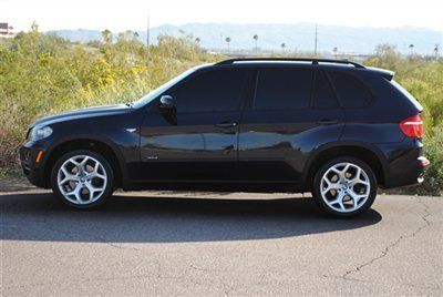 2008 bmw x5 3.0si....brand new tires.....20" sport oem wheels.....pano roof
