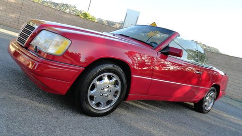 1994 mercedes e320 convertible with 75000 miles, red with parchment. perfect one