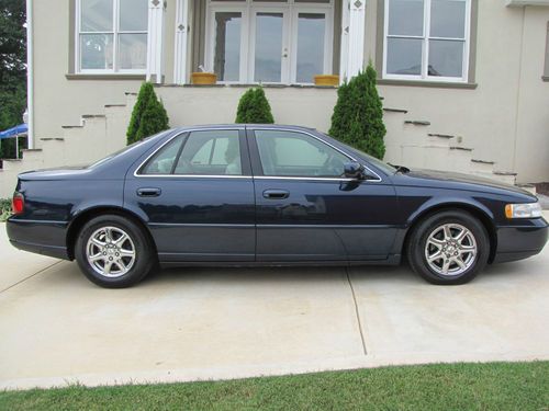2002 cadillac seville sts 39,000 original miles, navy with tan, chrome wheels.