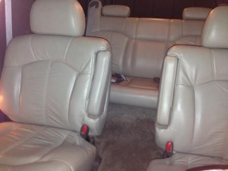 Burgandy with tan leather center bucket seats -