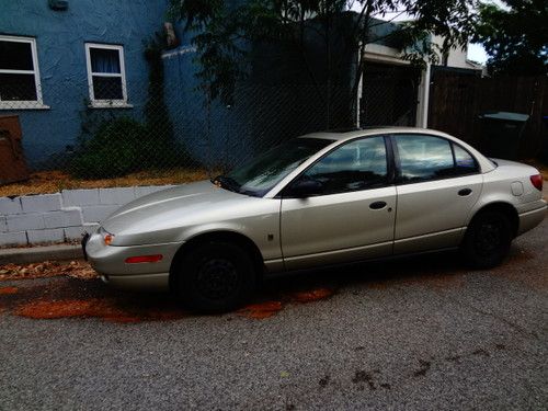 Gold saturn with tan interior.  runs excellent.  newer tires.