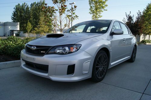 2011 subaru impreza wrx sedan. 20,011 miles spark silver. 5 speed manual. nice!