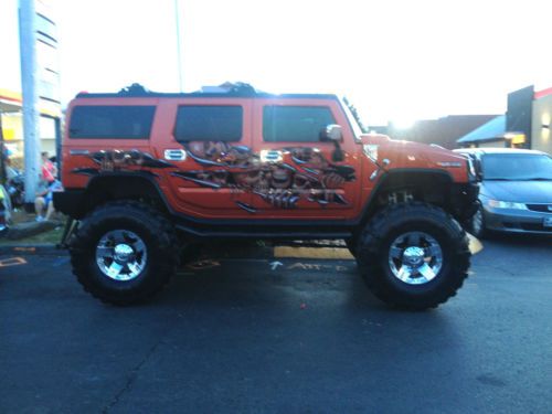 2003 jacked up hummer h2 with awesome air-brushed paint job