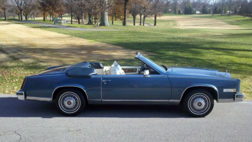 Cadillac eldorado biarritz, baby blue w/ white convertible top and white leather