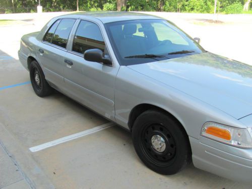 Ford crown victoria v-8 4 door gray in color. cloth seats. new tires. no dings.