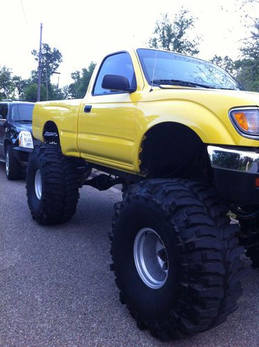 Toyota tacoma monster truck lifted on 44'' boggers