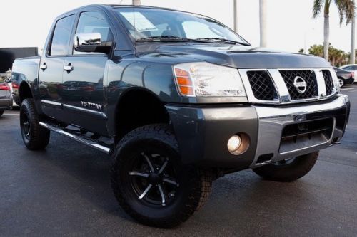07 titan se, lifted, pacer wheels, leather, we finance! free shipping!
