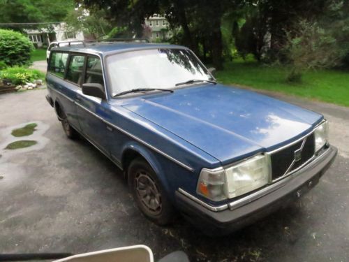1991 blue volvo 240 wagon 4-door