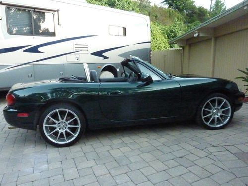 1999 mx-5 miata, enkei wheels, roll bar, new top, polk audio, kicker, great cond