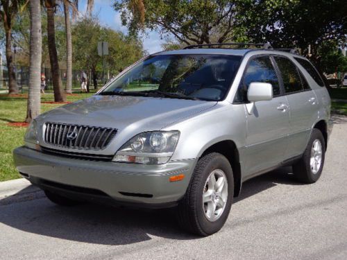 Silver/gray, sunroof, cd changer, s.fl, low miles, cold a/c, clean, new tires