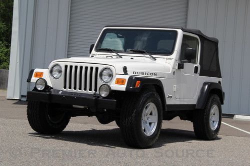 Rubicon, white, 6 spd manual, brand new a/t tires, 1 owner, only 32,000 miles!