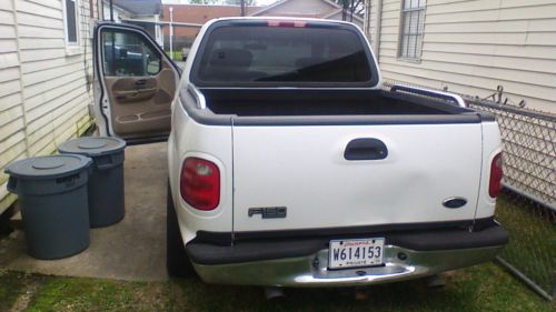2002 ford. f150 crew cab, white with tan interior
