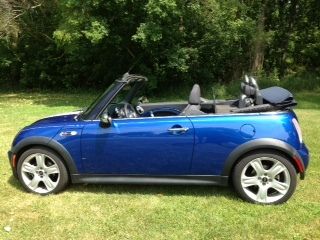 Blue convertible 2 door, low mileage, fully loaded, like-new condition