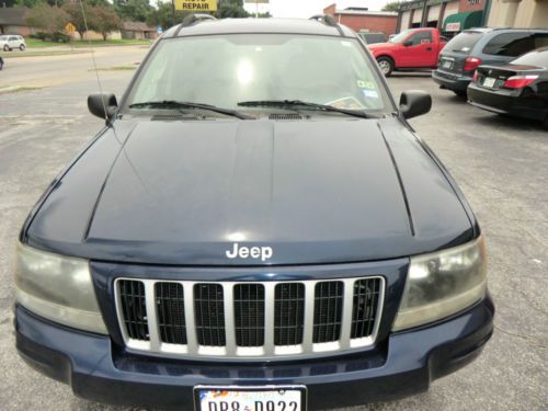 2004 jeep grand cherokee 4x4 v8 . leather , sun roof . ready for new drive way