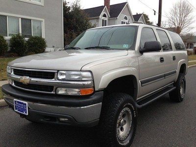 Lifted monster custom suburban low miles silver carfax finance 4x4 like new