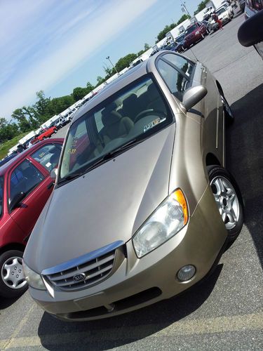 2004 kia spectra 4-door 4.cyl  2.0 ....great on gas manual transmission