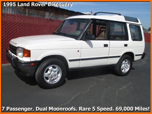 1995 land rover discovery!  5 speed. 69k miles. 7 seats. dual roofs. no reserve!