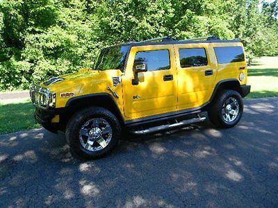 06 hummer h2...a bright yellow show off.new xd chromes /nittos...83k miles.wow!