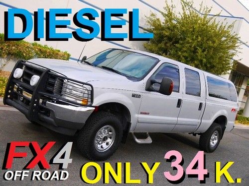 2003 f250 xlt fx4 only 34k. turbo diesel 4x4 crew cab camper shell no reserve