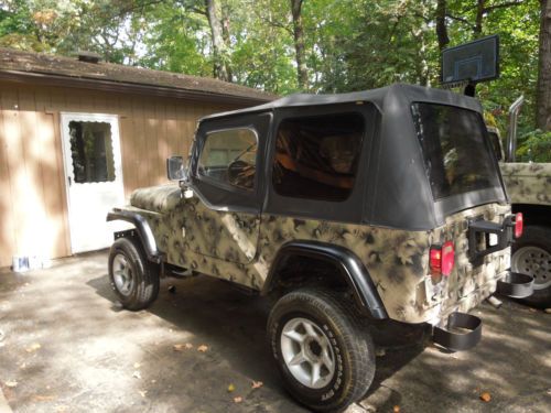 Nice camo jeep, drives great, new top, lifted, low reserve!!!