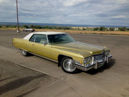 1973 cadillac 2d coupe deville, excellant running, gold color, leather interior