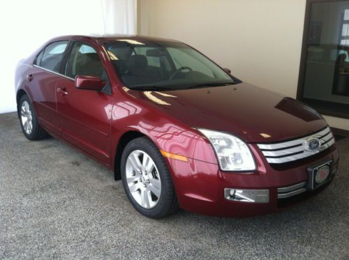 Maroon 4 door sedan black leather interior sunroof carfax two previous owners