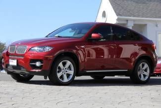 Vermilion red metallic auto awd msrp $82,995.00 only 1,854 miles loaded perfect