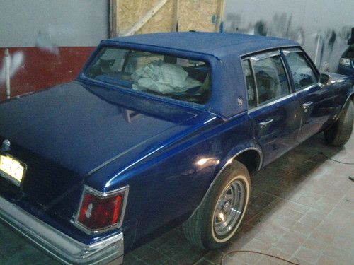 1976 custom cadillac seville blue with whit strip