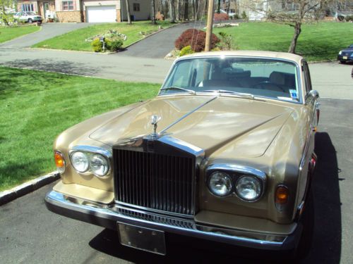 1975 silver shadow rolls royce with 82,083 miles.  exterior...champaigne/maroon