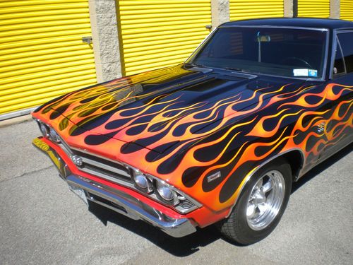 Custom black paint with flames ,shaved door handles lowered.number matching ss