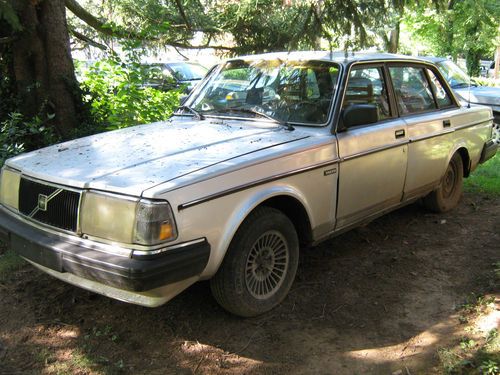 1986 silver volvo sedan (good condition, strong, and reliable car).