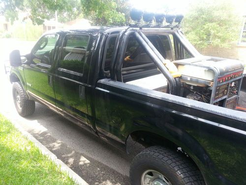 06 ford f 250 lifted 4x4 5speed, roll bar, kc lights, tool box, spray on liner