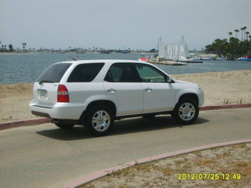 4 wheel drive, excelent condition, 2nd owner from 25,000miles, white/tan leather