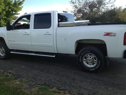 6.6 liter turbo diesel, white truck, good condition, barely any rust, crew cab