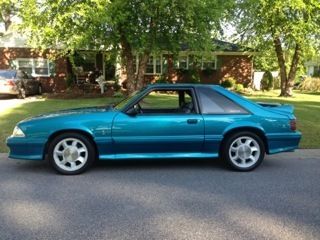 1993 teal svt cobra mustang. exc. condition. seats have always been covered.