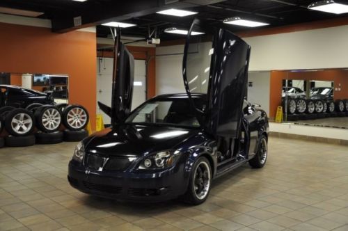 Gull wing doors, hid lights, spoiler, black wheels, new tires