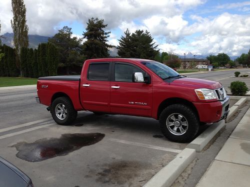 2005 nissan titan le crew cab, fully loaded, navigation,heated leather, dvd